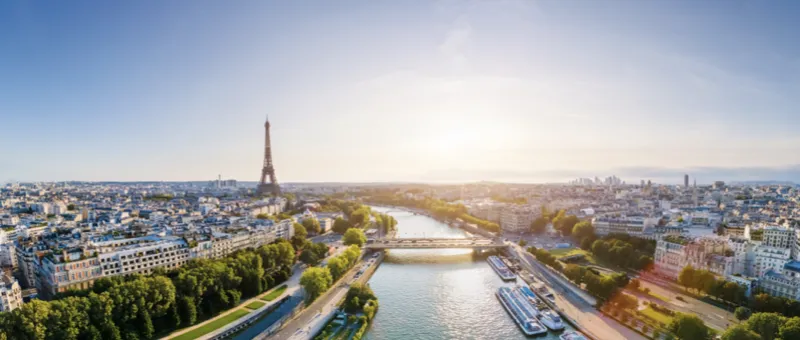 Paris with the Eiffel Tower at sunset, symbolizing sustainability, climate goals, and CO2 reduction in shipping